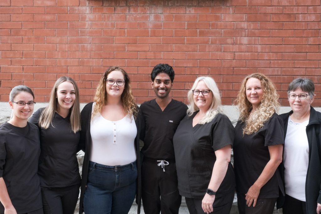 A photo of our team in front of our office. Learn more about us.