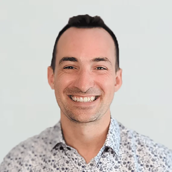 An image of a dentist smiling.